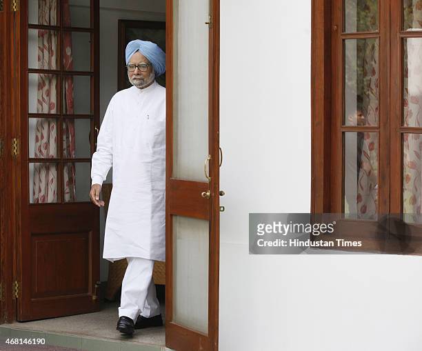 Former Prime Minister Manmohan Singh coming out after launching an online and application-based membership drive at his residence on March 30, 2015...