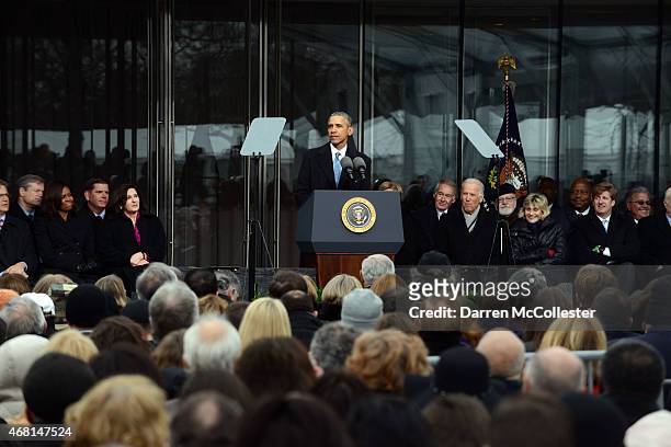 President Barack Obama speaks during the Edward M. Kennedy Institute Dedication Ceremony as First Lady Michelle Obama, Boston Mayor Marty Walsh, U.S....