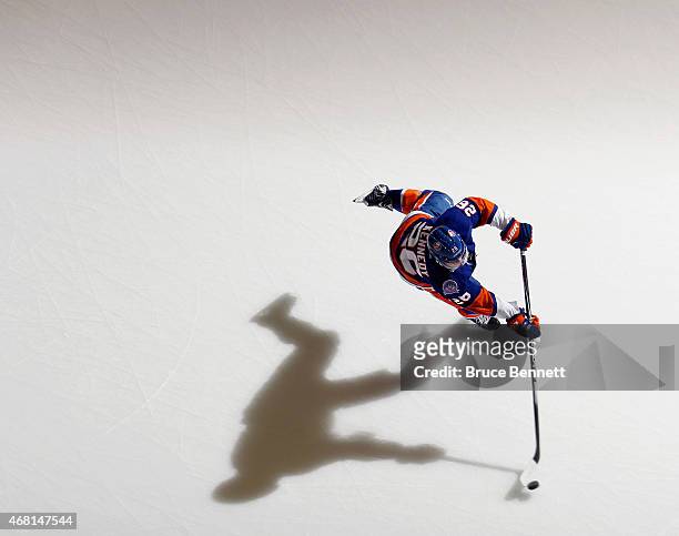 Tyler Kennedy of the New York Islanders skates in warm-ups prior to the game against the Detroit Red Wings at the Nassau Veterans Memorial Coliseum...