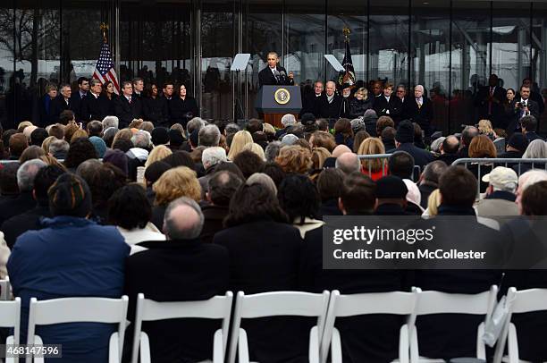 President Barack Obama speaks during the Edward M. Kennedy Institute Dedication Ceremony as Trent Lott, Tom Daschle, Edward Kennedy Jr., First Lady...