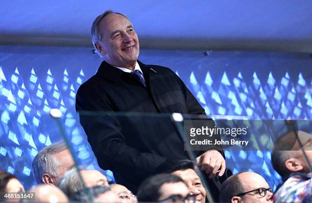 President of Latvia Andris Berzins cheers for the competitors of his country during the Opening Ceremony of the 2014 Winter Olympic Games at the...