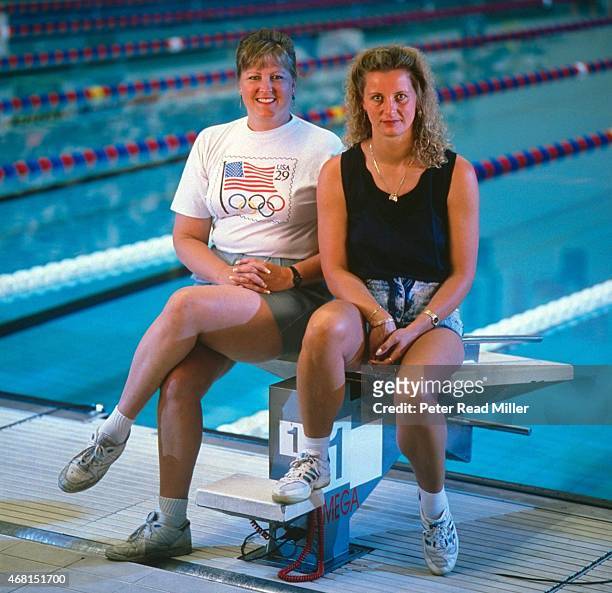 Portrait of former Olympic swimmers USA Shirley Babashoff and Germany Kornelia Ender posing on diving block at IUPUI Natatorium. Indianapolis, IN...