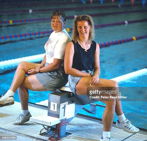 Portrait of former Olympic swimmers USA Shirley Babashoff and Germany Kornelia Ender posing on diving block at IUPUI Natatorium. Indianapolis, IN...
