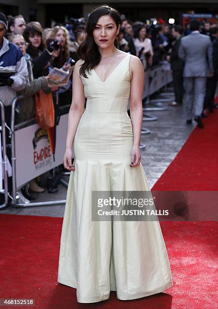 British actress Eleanor Matsuura poses for photographers as she arrives for the 2015 Empire Awards in central London on March 29, 2015. AFP PHOTO /...