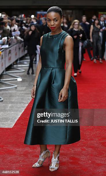 British actress Pippa Bennett-Warner poses for photographers as she arrives for the 2015 Empire Awards in central London on March 29, 2015. AFP PHOTO...