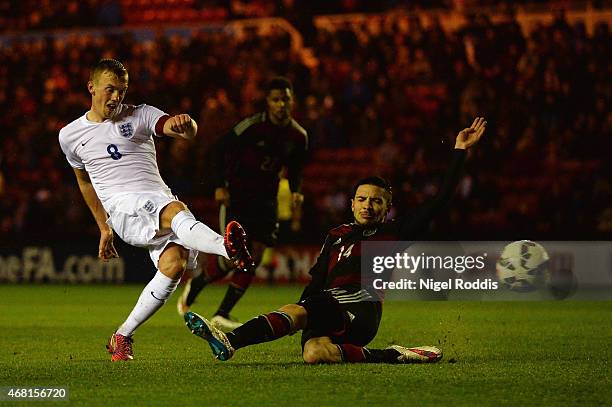 James Ward-Prowse of England scores their third goal under pressure from Julian Korb of Germany during the international friendly between England...