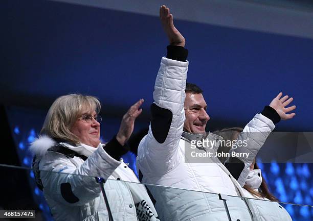 Prime Minister of Estonia Andrus Ansip and his wife Anu Ansip cheer for the competitors of his country during the Opening Ceremony of the 2014 Winter...