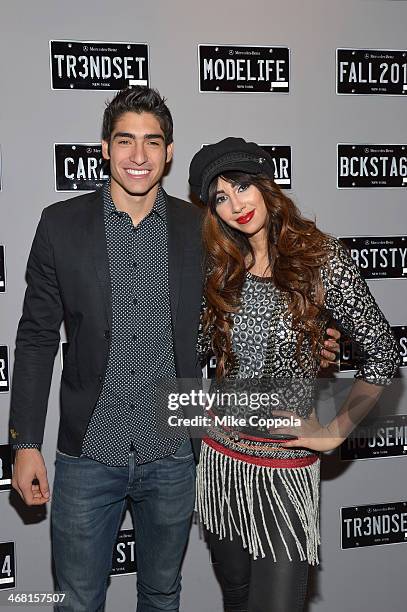 Model Francisco Escobar and Jackie Cruz attend the Mercedes-Benz Star Lounge during Mercedes-Benz Fashion Week Fall 2014 at Lincoln Center on...