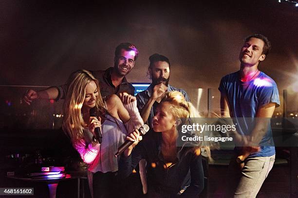 group of friends doing karaoke - dj summer stock pictures, royalty-free photos & images