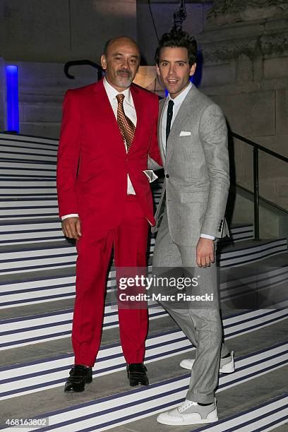 Christian Louboutin and singer Mika attend the 'Jean Paul Gaultier' exhibition opening cocktail at Grand Palais on March 30, 2015 in Paris, France.