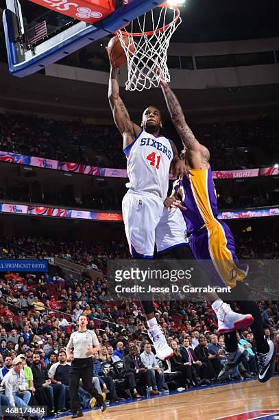 Thomas Robinson of the Philadelphia 76ers dunks the ball against the Los Angeles Lakers at Wells Fargo Center on March 30, 2015 in Philadelphia,...