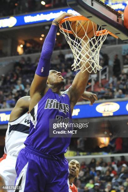 Sacramento Kings power forward Jason Thompson makes a jam during the first half against the Washington Wizards at the Verizon Center in Washington on...