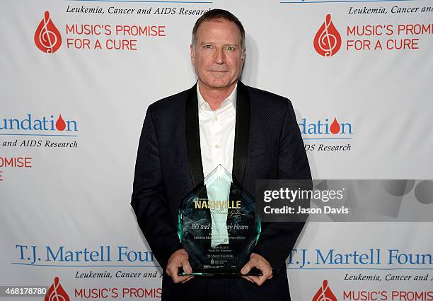 Bill Hearn accepts the Frances Preston Lifetime Music Industry Achievement Award on behalf of his father, Billy Ray Hearn, at the T.J. Martell...