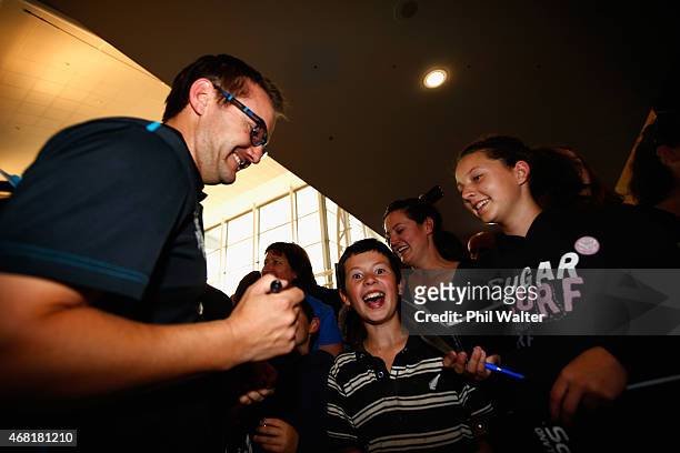 New Zealand Blackcaps coach Mike Hesson signs autographs after arriving at Auckland Airport on March 31, 2015 in Auckland, New Zealand. New Zealand...