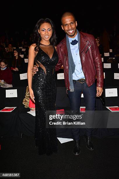 Actors Tashiana Washington and Eric West attend the Vivienne Tam show during Mercedes-Benz Fashion Week Fall 2014 at The Theatre at Lincoln Center on...