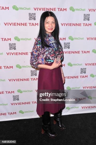 Designer Vivienne Tam poses backstage at the Vivienne Tam fashion show during Mercedes-Benz Fashion Week Fall 2014 at The Theatre at Lincoln Center...