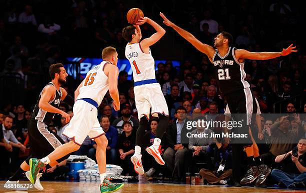 Alexey Shved of the New York Knicks in action against Tim Duncan of the San Antonio Spurs at Madison Square Garden on March 17, 2015 in New York...