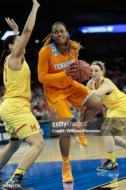 Bashaara Graves of the Tennessee Lady Vols drives between Brionna Jones and Kristen Confroy of the Maryland Terrapins during the 2015 NCAA Division I...