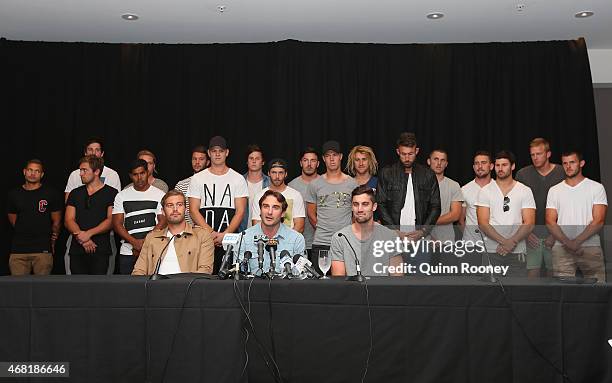 Jobe Watson the captain of the Bombers, flanked by his team mates talks to the media at the Pullman Hotel on March 31, 2015 in Melbourne, Australia....
