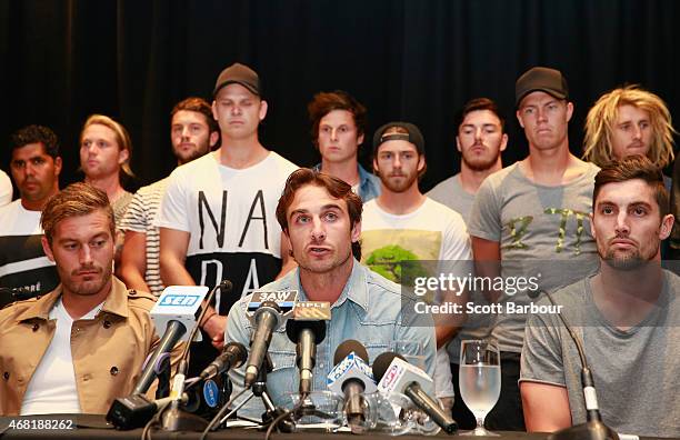 Jobe Watson the captain of the Bombers, flanked by his team mates talks to the media at the Pullman Hotel on March 31, 2015 in Melbourne, Australia....