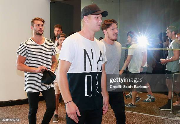 Michael Hurley and his Bombers teammates leave after speaking to the media at the Pullman Hotel on March 31, 2015 in Melbourne, Australia. The AFL...