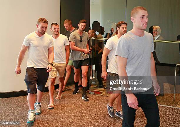 Players from the Bombers leave after speaking to the media at the Pullman Hotel on March 31, 2015 in Melbourne, Australia. The AFL anti-doping...
