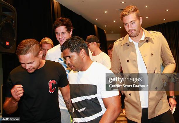 Jake Carlisle, Leroy Jetta, Tom Bellchambers and Bombers players leave after speaking to the media at the Pullman Hotel on March 31, 2015 in...