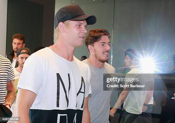 Michael Hurley and his Bombers teammates leave after speaking to the media at the Pullman Hotel on March 31, 2015 in Melbourne, Australia. The AFL...