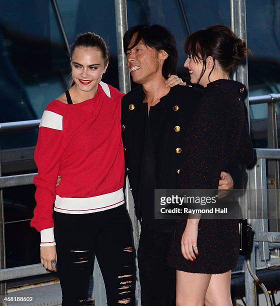 Model Cara Delevingne and Dakota Johnson are seen at the Chanel yacht party at Chelsea Pier on March 30, 2015 in New York City.