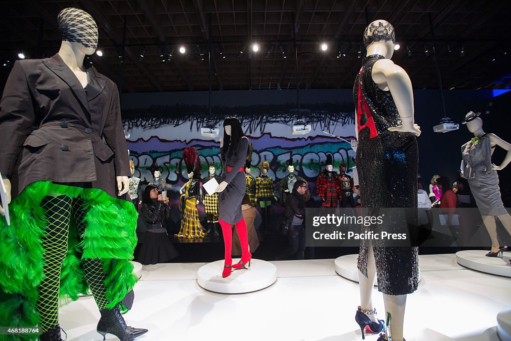 People look at creations of the French designer Jean-Paul...