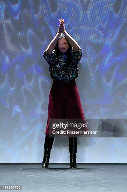 Designer Vivienne Tam poses on the runway at the Vivienne Tam fashion show during Mercedes-Benz Fashion Week Fall 2014 at Lincoln Center on February...