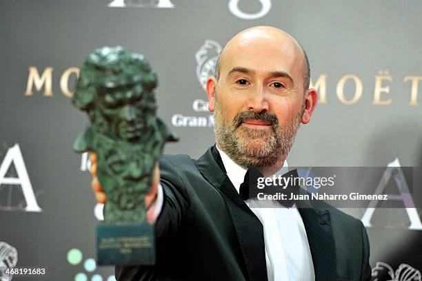 Spanish actor Javier Camara holds his award for best actor in the film 'Vivir Es Facil Con Los Ojos Cerrados' during the 2014 edition of the 'Goya...