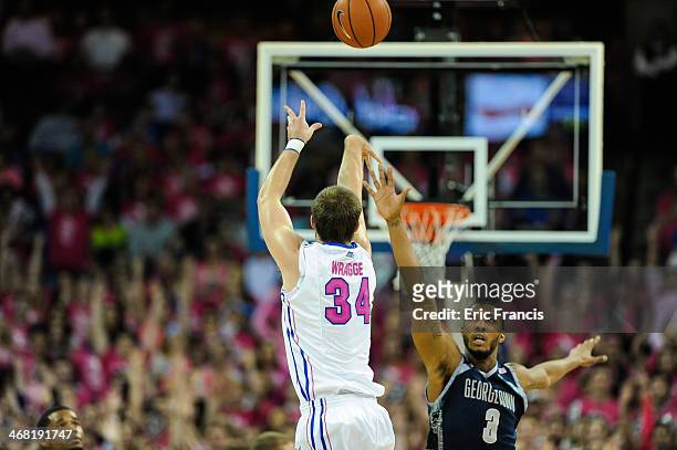 Ethan Wragge of the Creighton Bluejays shoots over Mikael Hopkins of the Georgetown Hoyas during their game at CenturyLink Center on January 25, 2014...