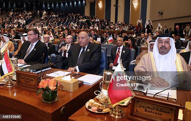Egyptian Foreign Minister Sameh Shoukry and Bahraini Finance Minister Sheikh Ahmad bin Mohammad al-Khalifa attend the opening ceremony of the Second...