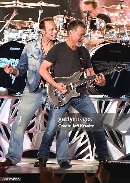 David Lee Roth, Eddie Van Halen and Alex Van Halen of Van Halen performs on March 30, 2015 in Hollywood, California.