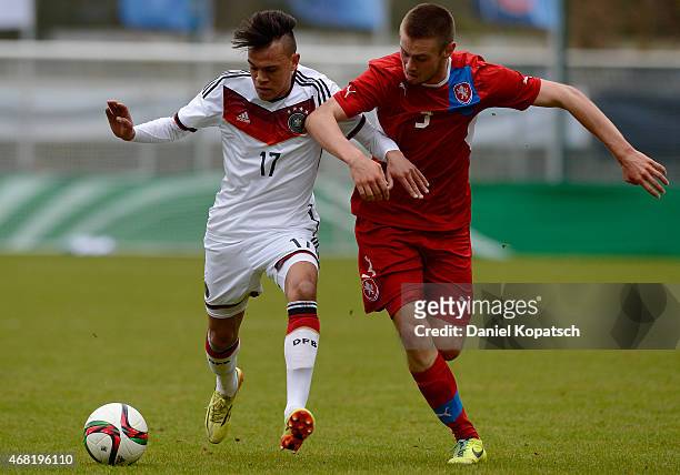 Devante Parker of Germany is challenged by Miroslav Routek of Czech Republic during the UEFA Under19 Elite Round match between Germany and Czech...