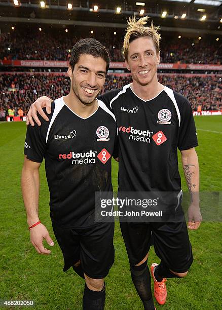 Luis Suarez and Fernando Torres walk around the pitch at the end of the Liverpool All Star Charity Match at Anfield on March 29, 2015 in Liverpool,...