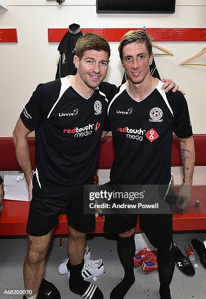 Steven Gerrard poses for a photo with Fernando Torres during the Liverpool All Star Charity Match at Anfield on March 29, 2015 in Liverpool, England.