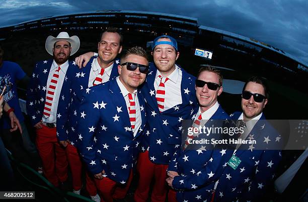 Group of fans gathers around the par-three 16th hole during the third round of the Waste Management Phoenix Open at TPC Scottsdale on January 31,...