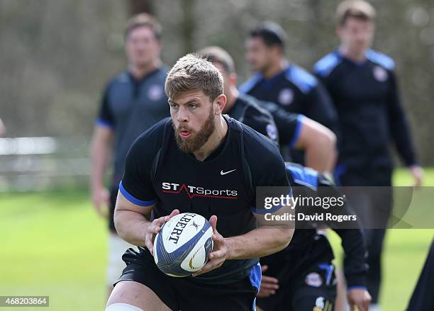 Dave Attwood runs with the ball during the Bath training session held at Farleigh House on March 31, 2015 in Bath, England.