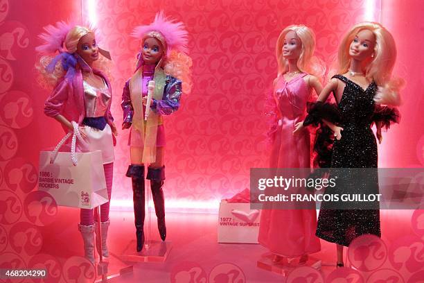 Barbie dolls are displayed on April 6, 2009 in Paris during the "Barbie Fashion show 2009", an exhibition dedicated to the world's most famous toy,...