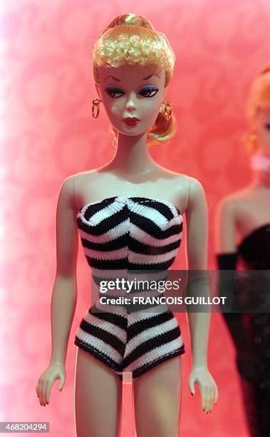 The first Barbie doll, created in 1959 is displayed on April 6, 2009 in Paris during the "Barbie Fashion show 2009", an exhibition dedicated to the...