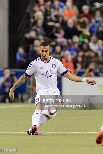 Seb Hines of the Orlando City SC kicks the ball during the MLS game against the Montreal Impact at the Olympic Stadium on March 28, 2015 in Montreal,...