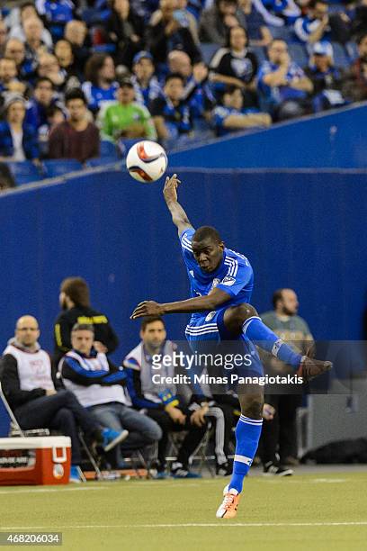 Bakary Soumare of the Montreal Impact kicks the ball during the MLS game against the Orlando City SC at the Olympic Stadium on March 28, 2015 in...