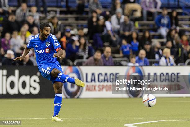 Patrice Bernier of the Montreal Impact kicks the ball during the MLS game against the Orlando City SC at the Olympic Stadium on March 28, 2015 in...