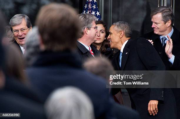 President Barack Obama greets former Sen. Trent Lott, R-Miss., far left, as Edward Kennedy Jr., and Gov. Charlie Baker, R-Mass., right, look on,...