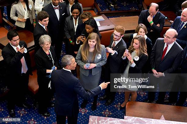 President Barack Obama talks with guests during an opening ceremony for a life-size replica of the Senate Chamber that was part of the dedication...