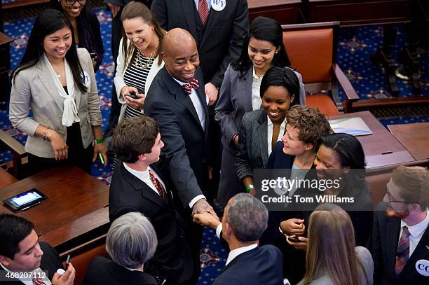 Senate Chaplain Barry Black, top, greets President Barack Obama, during an opening ceremony for a life-size replica of the Senate Chamber that was...