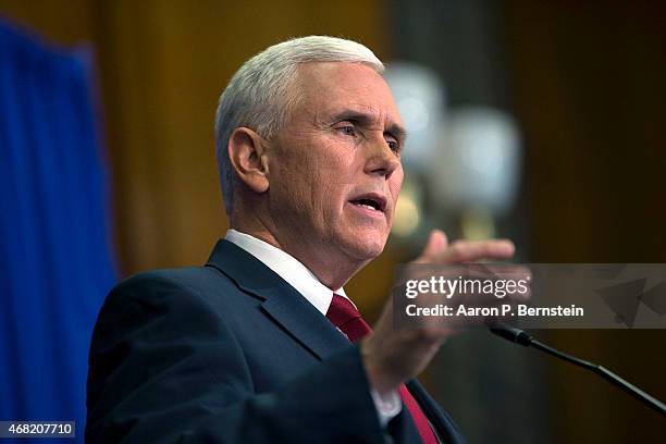 Indiana Gov. Mike Pence speaks during a press conference March 31, 2015 at the Indiana State Library in Indianapolis, Indiana. Pence spoke about the...