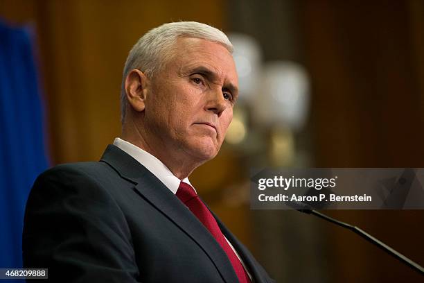 Indiana Gov. Mike Pence speaks during a press conference March 31, 2015 at the Indiana State Library in Indianapolis, Indiana. Pence spoke about the...